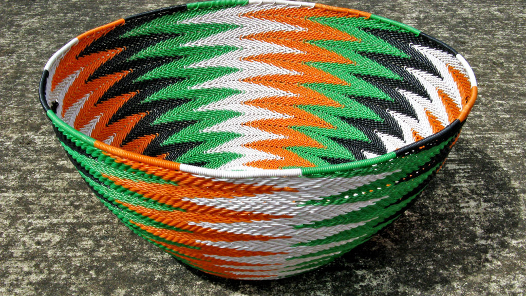 The basket I have donated to Animals Asia in a chevron pattern of black, white, green and orange wires.