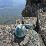 Telephone-wire basket in progress, on the dolerite rocks of the peak of Mt Field West, Tasmania.