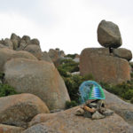 Telephone-wire basket sitting on top of a cairn in front of Rocking Stone on Mt Wellington, Hobart, Tasmania.
